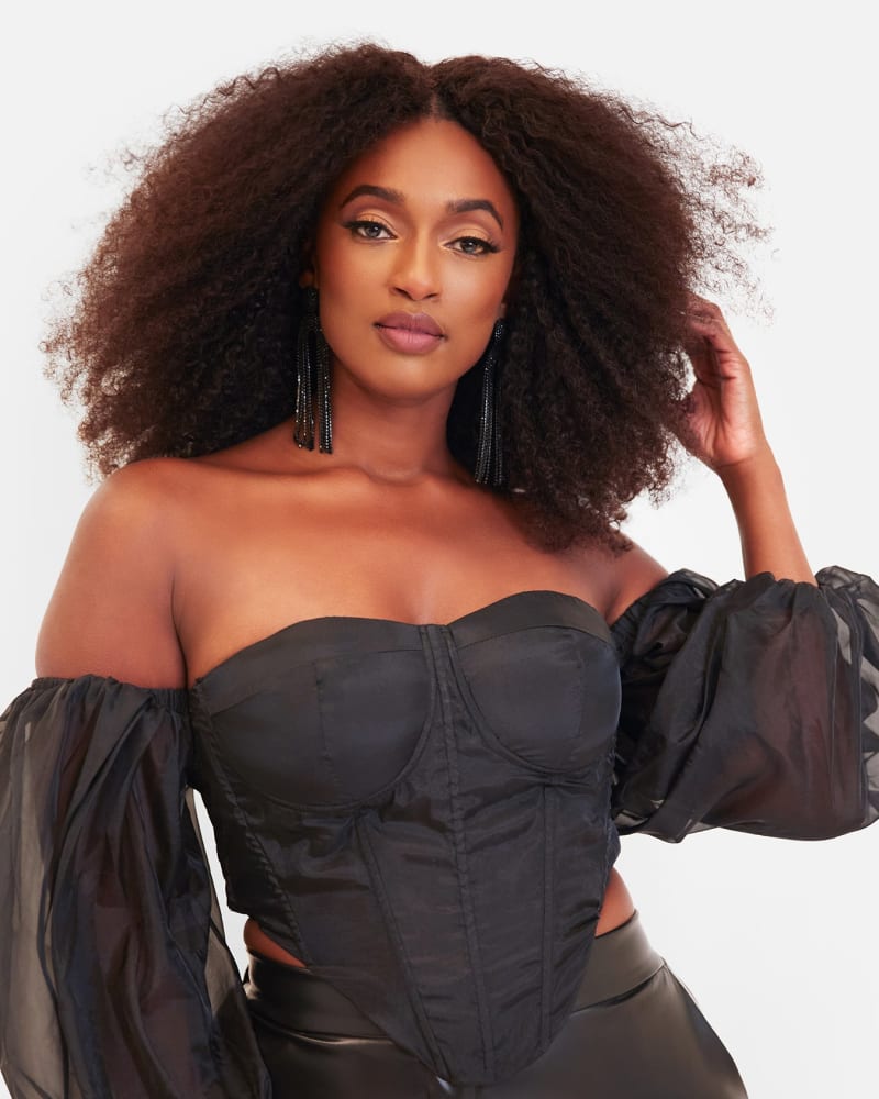 Side of a model wearing a size 4X Maya Tulle Sleeve Sheer Corset Top in Black by Rebdolls. | dia_product_style_image_id:321327